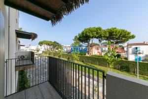a balcony with a view of a city at Caribe Village in Lido di Jesolo