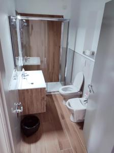 a bathroom with a toilet and a sink and a shower at Affittacamere Ristorante Lo Scudo in Vasto