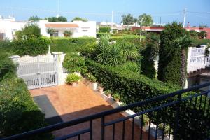 a view of a garden with a fence and plants at Villa Franca in Giovinazzo