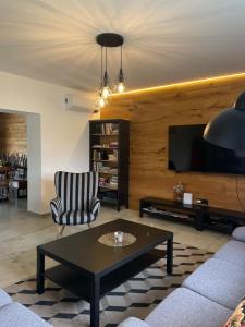 a living room with a couch and a coffee table at Kuća za odmor Šofika in Sveti Ivan Žabno