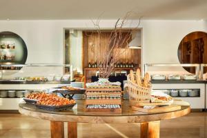 a table with food on it in a kitchen at NH Marina Portimao Resort in Portimão