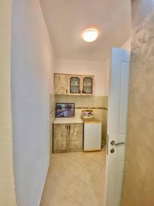 Kuchyň nebo kuchyňský kout v ubytování Apartments Lobby