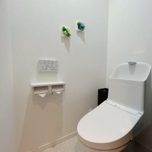 a white bathroom with a toilet and a clock on the wall at アンドステイ野方2丁目 in Tokyo +32 photos