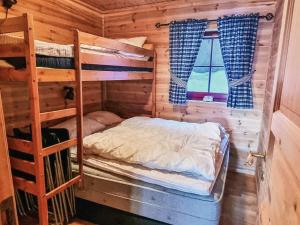 a bedroom with a bunk bed in a cabin at 8 person holiday home in ÅSERAL in Hamkoll