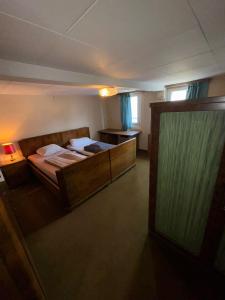 a bedroom with a large bed in a room at Spacious Local Lounge Apartment in Kelkheim