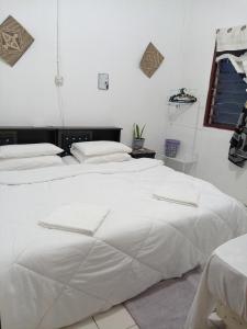 Postel nebo postele na pokoji v ubytování Mulu D Cave Homestay Room 2