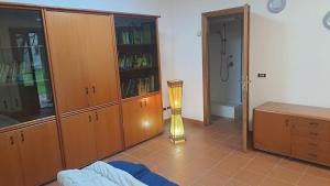 Ένα ή περισσότερα κρεβάτια σε δωμάτιο στο Ufficio al vivaio