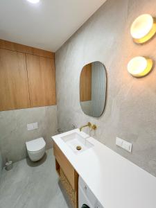 Ванная комната в Mint Apartments Seaside +25 фотографий