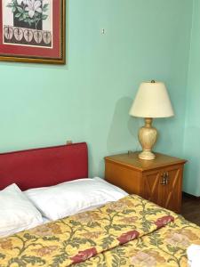Letto o letti in una camera di Hotel Lileo