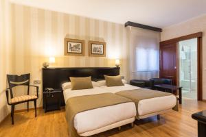 Кровать или кровати в номере BYPILLOW California