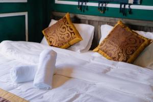 Postel nebo postele na pokoji v ubytování Ma Pi Leng Hotel