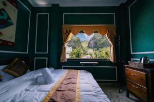 Postel nebo postele na pokoji v ubytování Ma Pi Leng Hotel