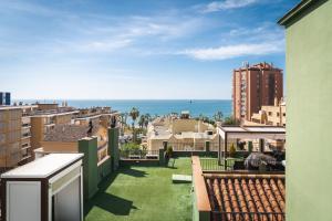 a view of the ocean from the balcony of a building at BYPILLOW California in Málaga