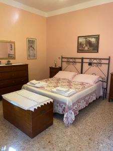 Posteľ alebo postele v izbe v ubytovaní Casa del Capitano Rocca d'Orcia