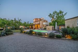 a house with a swimming pool in a yard at Villa Ivona with pool in Poljica