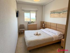 Postel nebo postele na pokoji v ubytování Luz de Mar