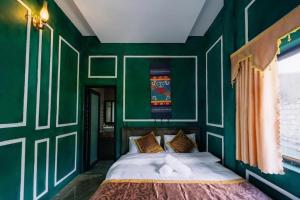 Postel nebo postele na pokoji v ubytování Ma Pi Leng Hotel