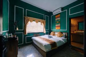 Postel nebo postele na pokoji v ubytování Ma Pi Leng Hotel