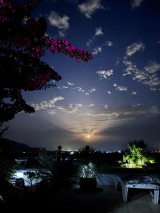 a view of the sunset from a patio at night at Renbeck lets 1 in Urcal +8 photos