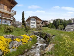 a stream in front of a house at Apartment La Toura by Interhome in Verbier