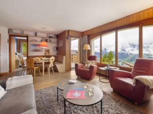 a living room with a couch and a table at Apartment La Toura by Interhome in Verbier