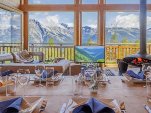 a dining room with a table with wine glasses on it at Chalet Woovim 8 by Interhome in Nendaz