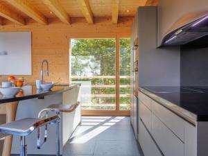 a kitchen with a counter and a sink at Chalet Woovim 8 by Interhome in Nendaz +58 photos