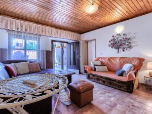 a living room with a couch and a table at Holiday Home Pinezici-1 by Interhome in Marčana