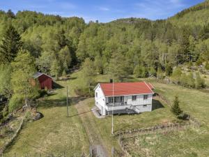 an overhead view of a white house with a red roof at Holiday Home Olavbu by Interhome in Åseral