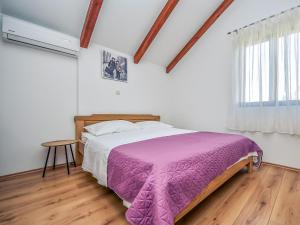 Postel nebo postele na pokoji v ubytování Holiday Home Jolumar by Interhome