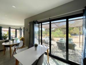 a living room with a large sliding glass door at Villa Atitudo Nature in Portimão