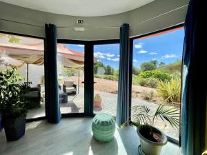 a room with a large glass door to a patio at Villa Atitudo Nature in Portimão