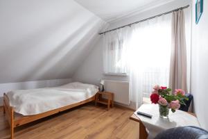 Postel nebo postele na pokoji v ubytování Dom Gościnny "Berberys"