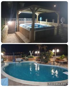 a swimming pool at night with a gazebo at Villa eden luxury con piscina e jacuzzi in Agrigento
