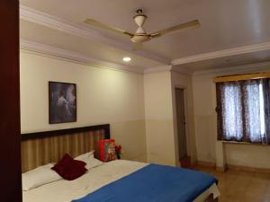 Postel nebo postele na pokoji v ubytování lakshmi inn lodge + 11 fotografií