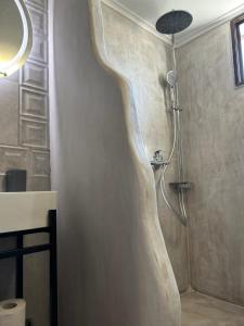 A bathroom at ''Mary's House'' Entire residence Olympiada Halkidiki Near to Sea 200m !