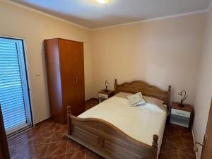 Voodi või voodid majutusasutuse Apartmani Stanisic toas