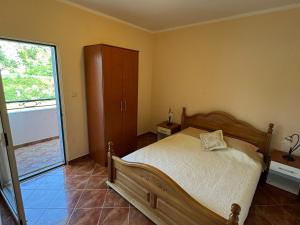 Voodi või voodid majutusasutuse Apartmani Stanisic toas