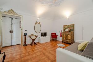 a living room with a couch and a table at Piazza Vittorio Veneto Elegant Flat in Turin