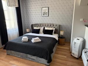 Posteľ alebo postele v izbe v ubytovaní H-T-L Apartamenty Junior + 34 fotografií