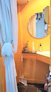 a bathroom with a sink and a mirror at Cozy full Apartment 2 bedroom central area in Hong Kong +29 photos