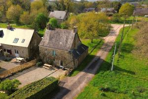 an aerial view of an old house and a road at La Vigne, La Ville Josse in Plessala