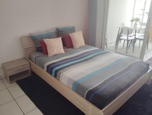 Postel nebo postele na pokoji v ubytování Studio Vanille - Vue Mer