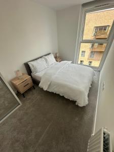 Кровать или кровати в номере London Bliss Apartment Retreat