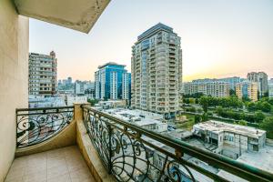 a balcony with a view of a city at Marina Luxury Apartment in Nizami st in Baku