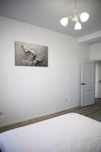 Postel nebo postele na pokoji v ubytování Prime Apartments Kostanay 2