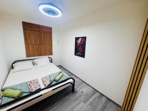 Ένα ή περισσότερα κρεβάτια σε δωμάτιο στο Villa Lakeview Appartment Tomori