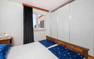 Postel nebo postele na pokoji v ubytování Apartment Medulin Krase Ii