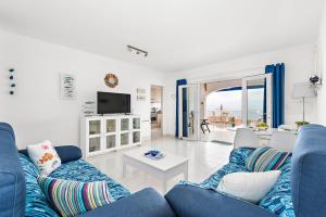 Et tv og/eller underholdning på Apartamento en Alta Mar