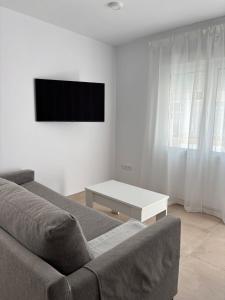 Μια τηλεόραση ή/και κέντρο ψυχαγωγίας στο Alojamientos VICTORIA MAR-CHIPIONA-